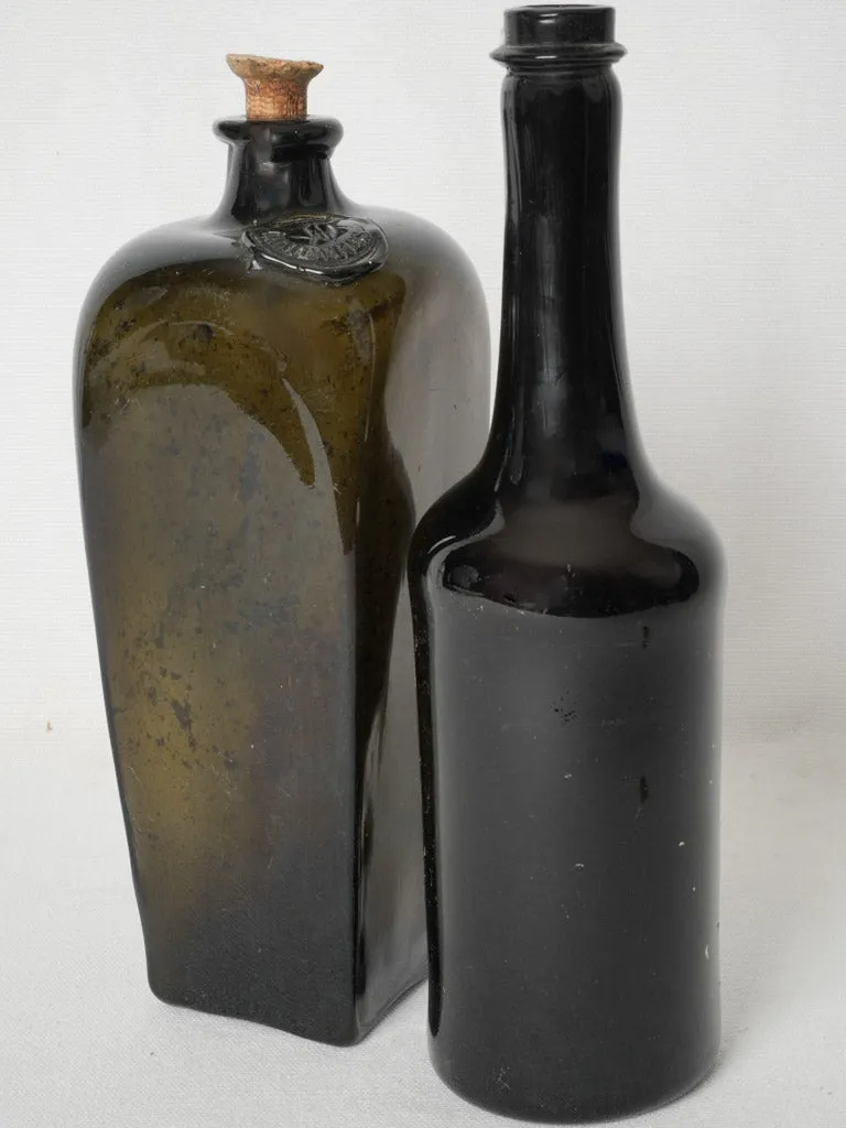 Set of 2 English antique blown glass bottles